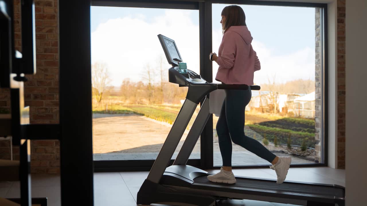 a young girl exercising in a renovated basement