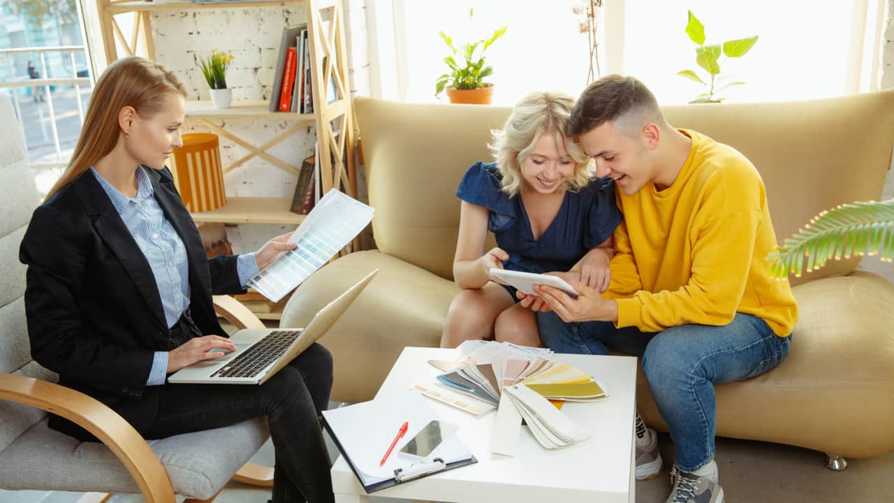 Interior designer working with young couple