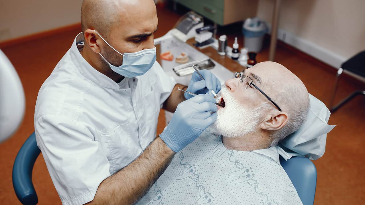 old man in dentist's clinic