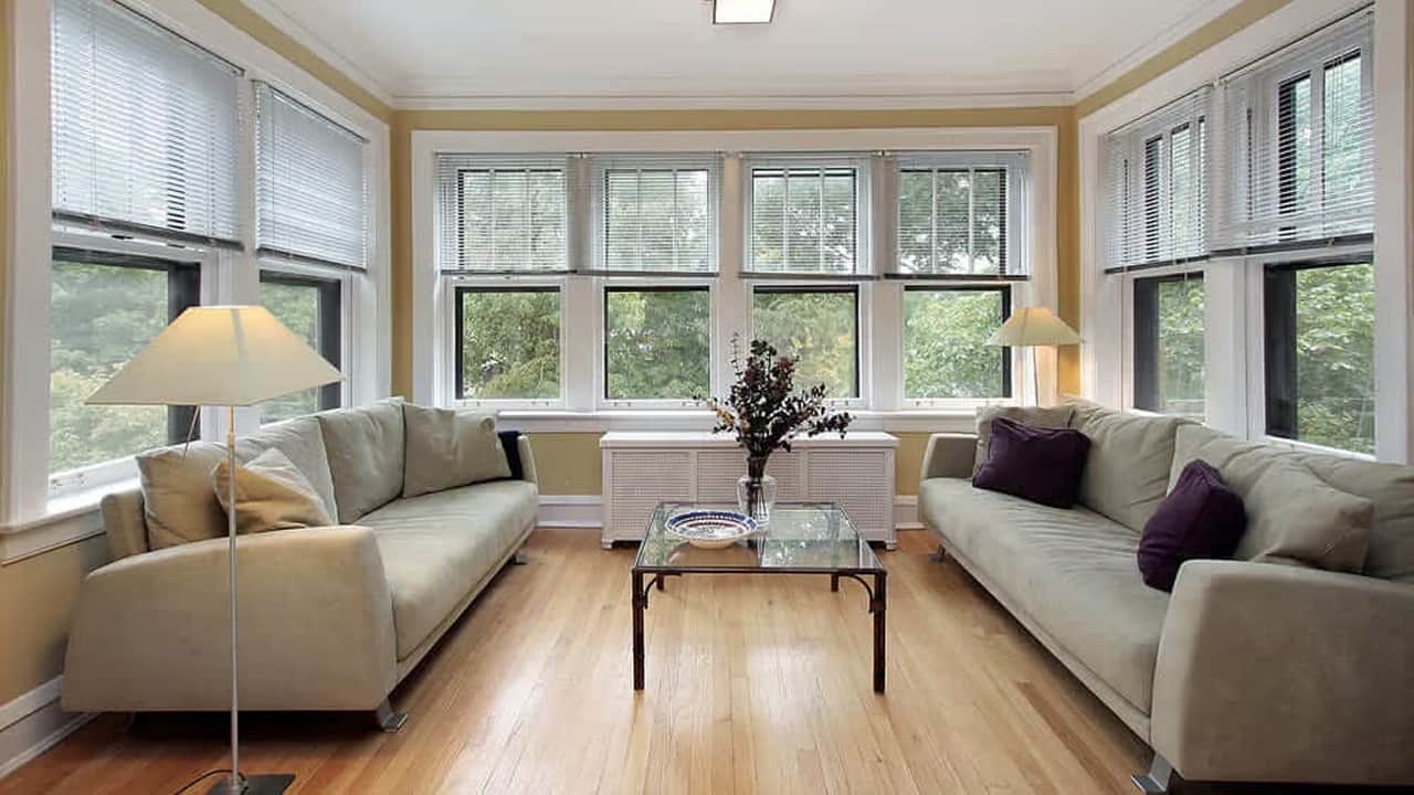 A beautiful view of a sunroom with a wooden floor is absolutely the best sunroom flooring ideas